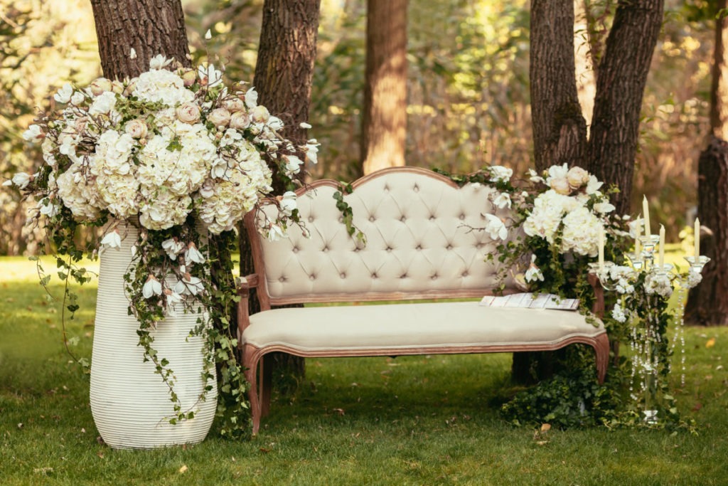 luxury wedding decorations with bench, candle and flowers compis